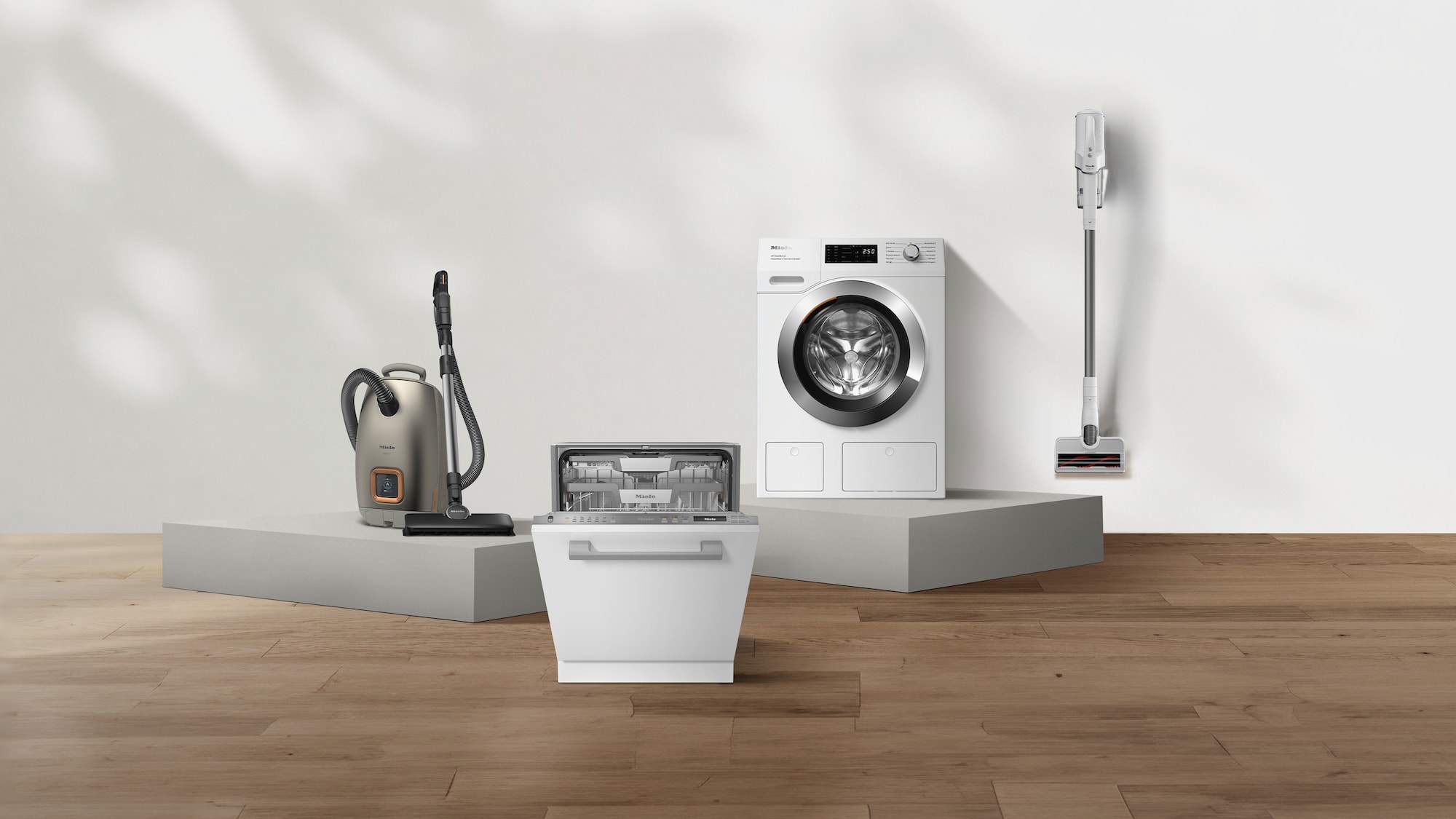 laundry room with hanged shirts and Miele washing machine
